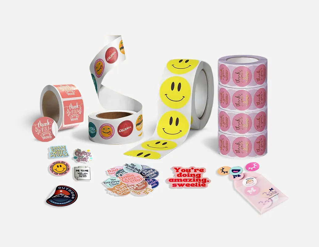 A variety of stickers, including roll labels, smiley face stickers, thank you labels, and custom die-cut sticker designs